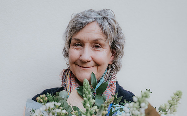 Helen Carlin, Rowan Alba CEO with flowers